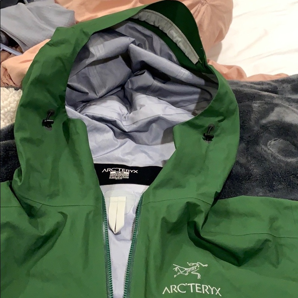 Green Arc’teryx rain jacket